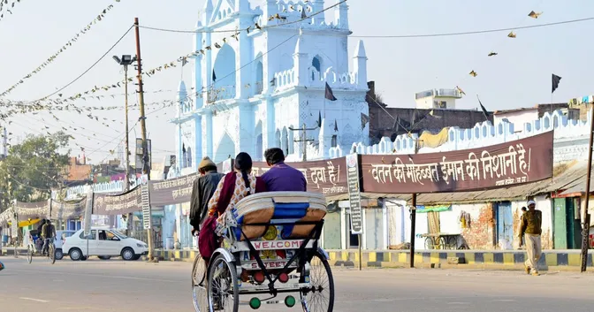 A couple siting together riding a rickshaw in a new city