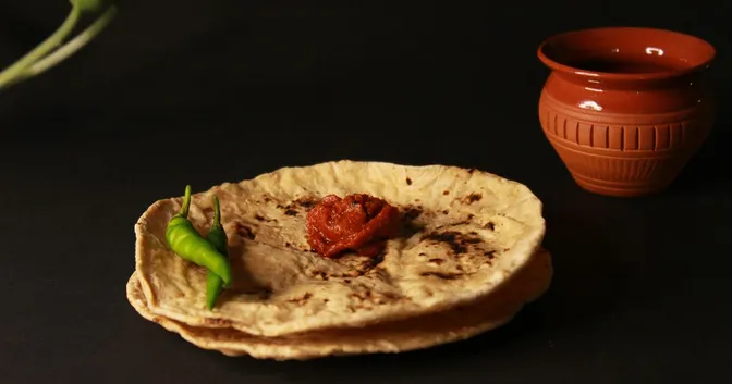 Roti bread and chilli on a plate